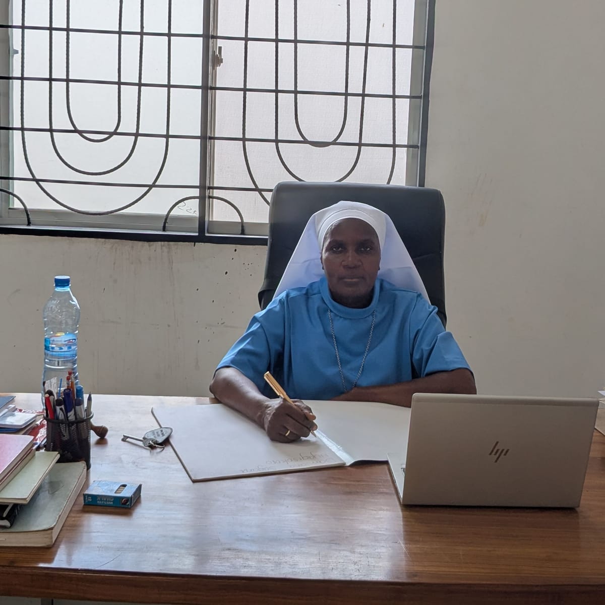 Sr. Damiana Sagala, Headteacher, at her desk